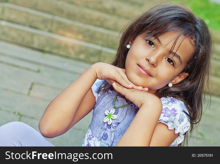 Portrait of happy little girl in a summer day. Portrait of happy little girl in a summer day