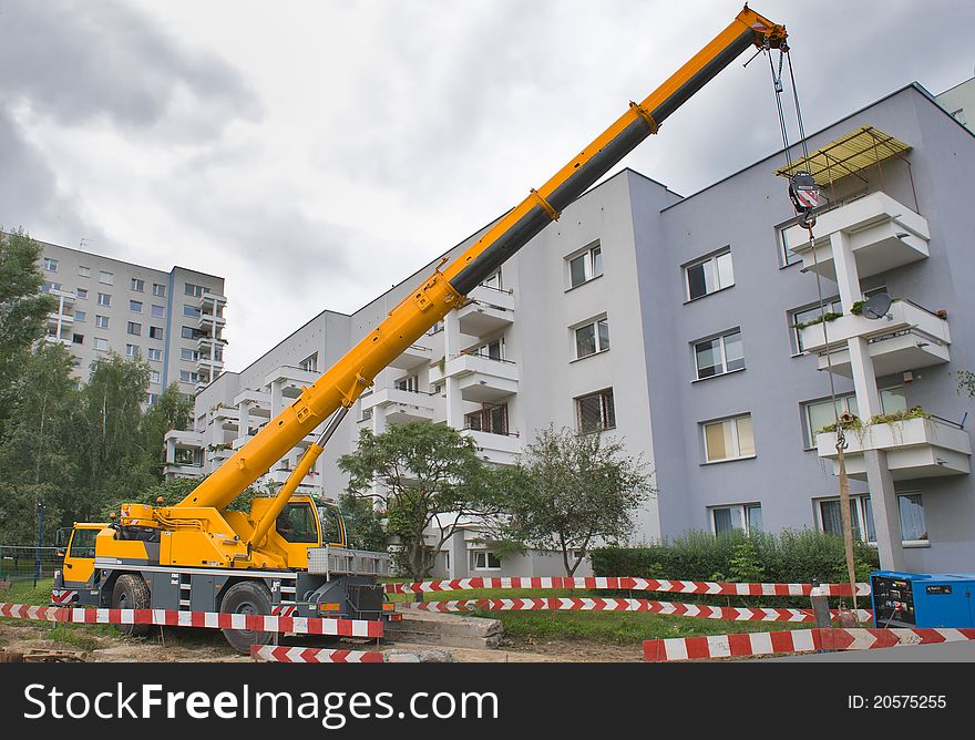 Yellow Automobile Crane With Risen Telescopic Boom