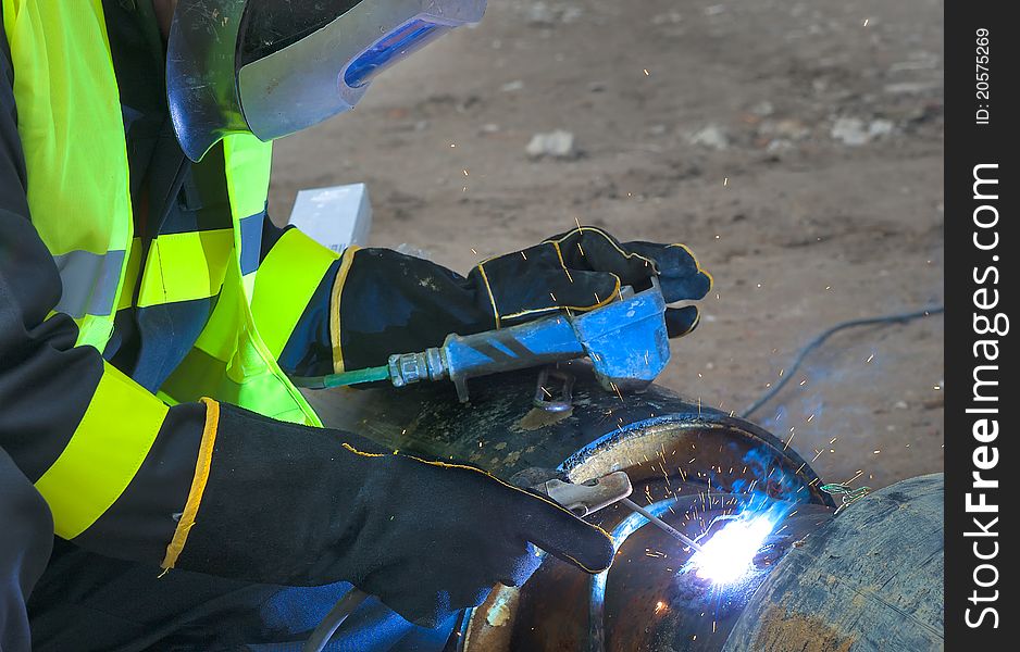 Welder Covered With  Protective Mask
