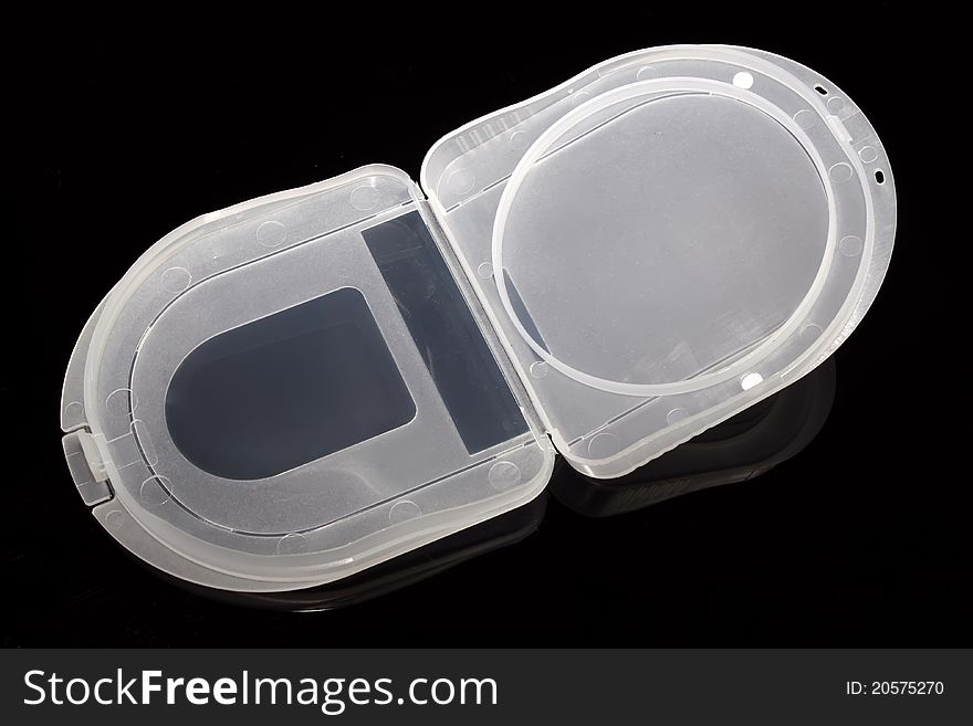 Plastic packing box on the black background