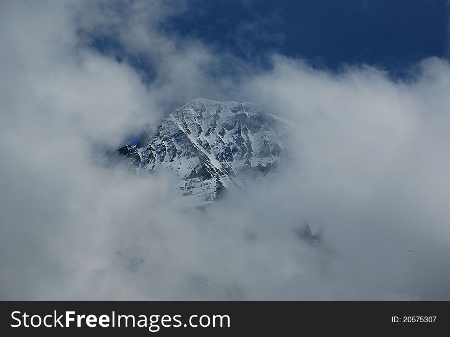 Snow mountain of Jungfraujoch in south of Swiss, very cloudy but just few minutes the peak appear. Snow mountain of Jungfraujoch in south of Swiss, very cloudy but just few minutes the peak appear