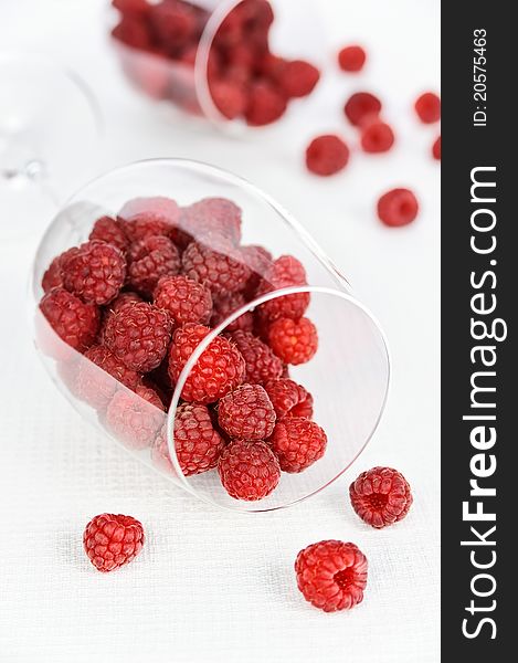 Raspberry in a glass on the white background