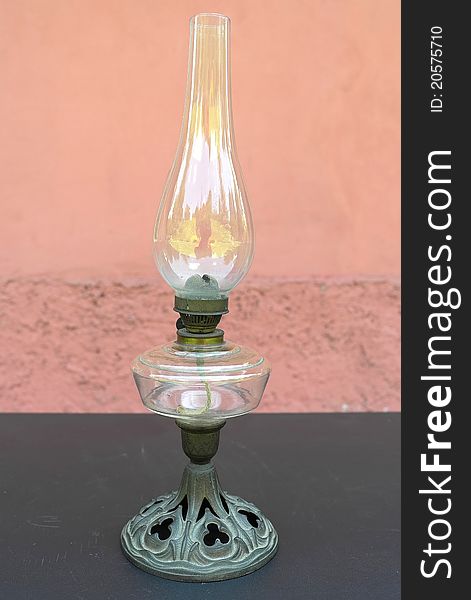 The old kerosene lamp, built on a black table.