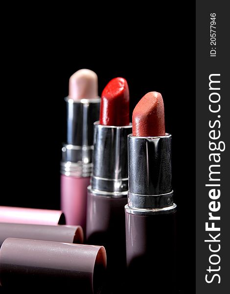 Three lipsticks in different colours