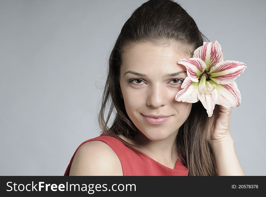 White female posing with beautiful lily flower. White female posing with beautiful lily flower