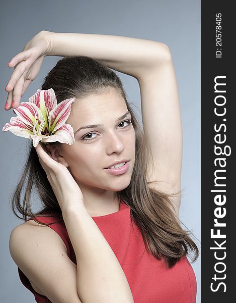 White female posing with beautiful lily flower. White female posing with beautiful lily flower