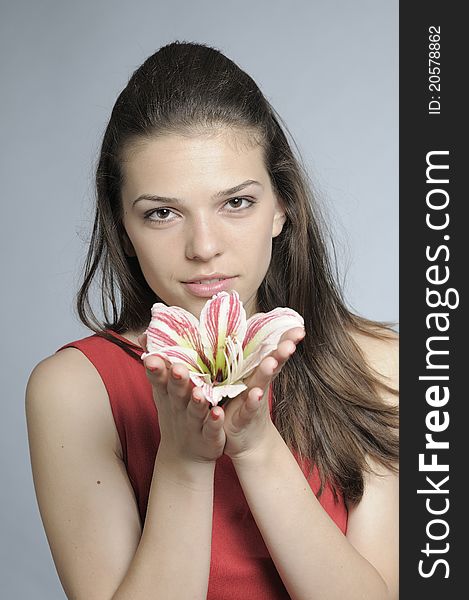 Pretty white girl posing with lily flower. Pretty white girl posing with lily flower