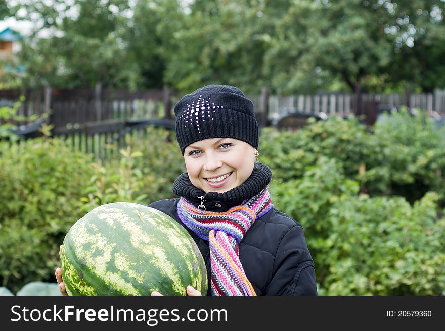 Beautiful woman smiling while holding watermelon. Beautiful woman smiling while holding watermelon