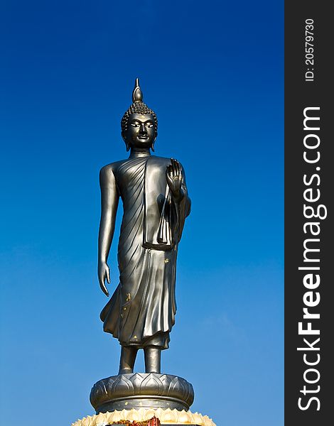 Life style Buddha statue in blue sky made from metal