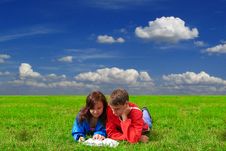 Two Teenagers Studying Outdoors On Grass Stock Photos
