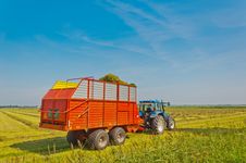 Collecting Grass With Tractor And Silage Wagon Stock Image Collecting Grass With Tractor And Silage Wagon Stock Image
