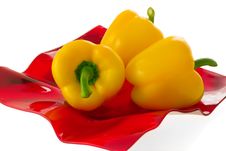 Yellow Bell Pepper On A Red Plate. Stock Photos