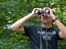 Young Man Looking Through Binoculars Stock Photography Young Man Looking Through Binoculars Stock Photography