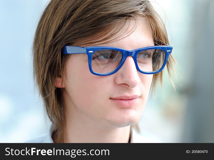 Closeup portrait of a handsome young man wearing glasses. Closeup portrait of a handsome young man wearing glasses