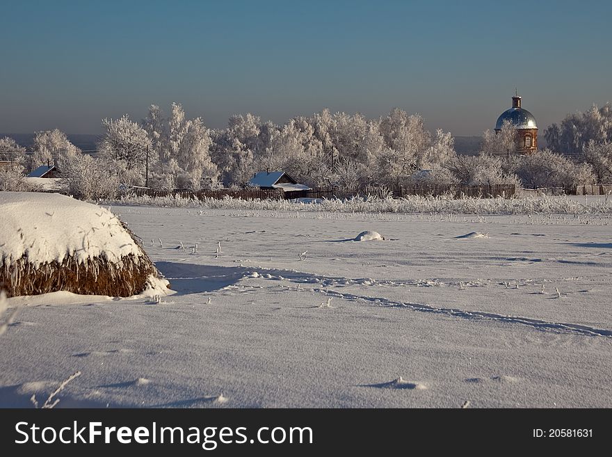 A snow sunny day in Russia countryside. A snow sunny day in Russia countryside.