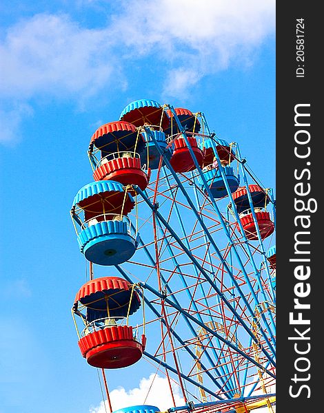 Ferris Wheel over blue sky