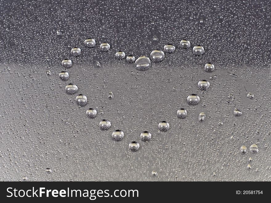 Water Drops Formed Into Heart Shape On Condensation. Water Drops Formed Into Heart Shape On Condensation