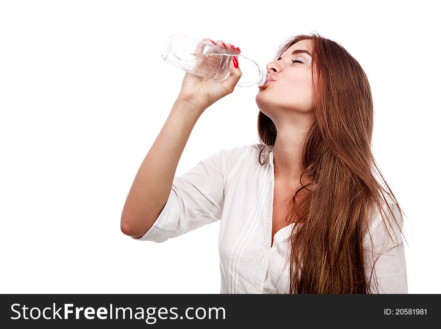 Beautiful girl drinking water isolated on white