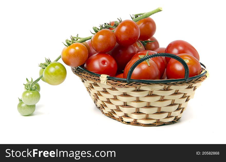 Tomatoes in basket on white background