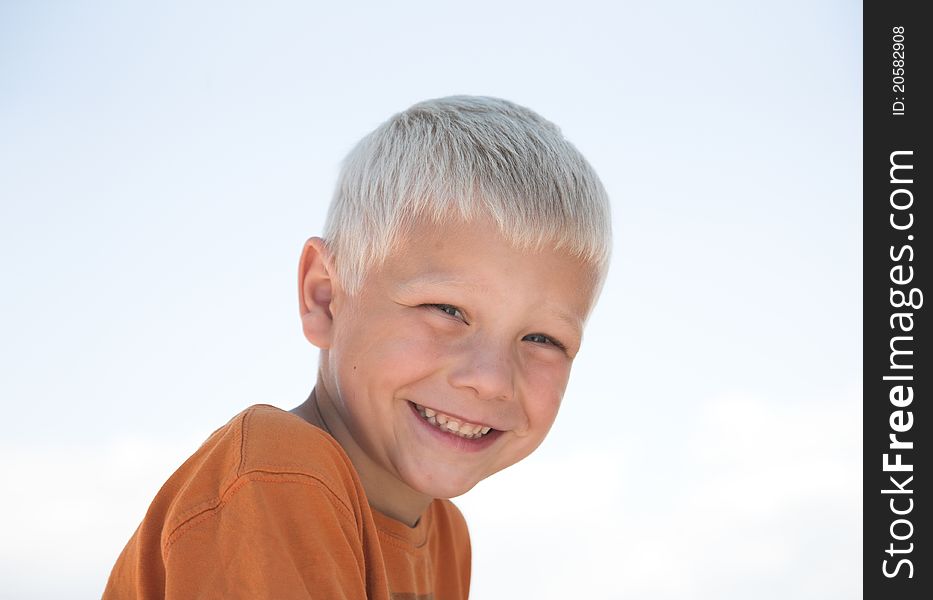 Little boy smiles outdoor
