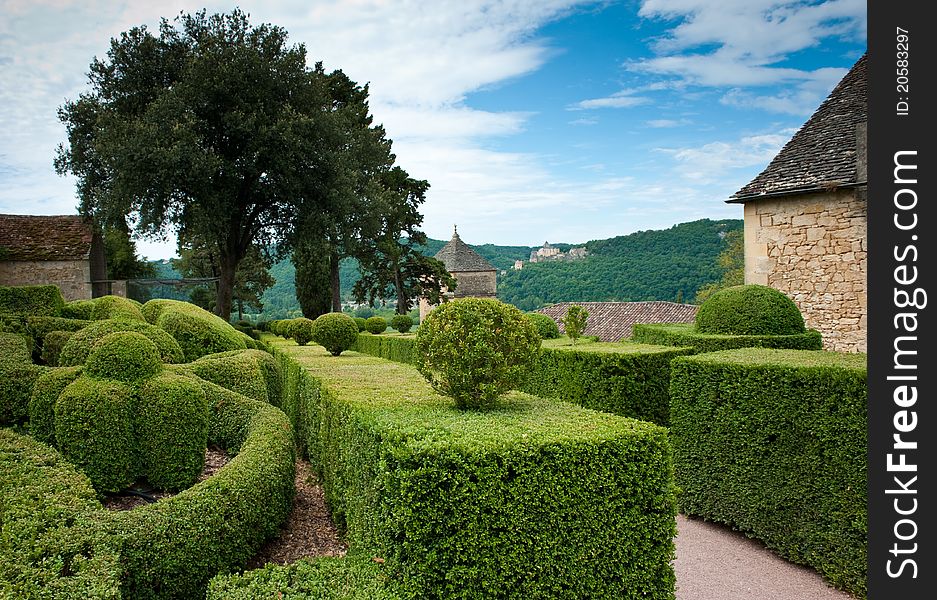 View of a French village and Chateau on a hillside. View of a French village and Chateau on a hillside