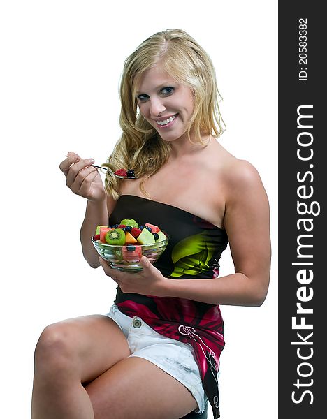 Beautiful Blonde Girl Smiling while Enjoying Healthy Food. Beautiful Blonde Girl Smiling while Enjoying Healthy Food