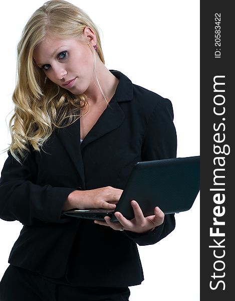 Young girl in the office with a nebook, looking at you