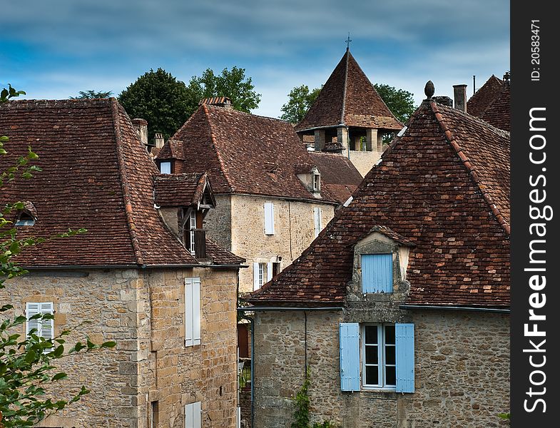 The village of Limeuil in France, rooftops and church. The village of Limeuil in France, rooftops and church