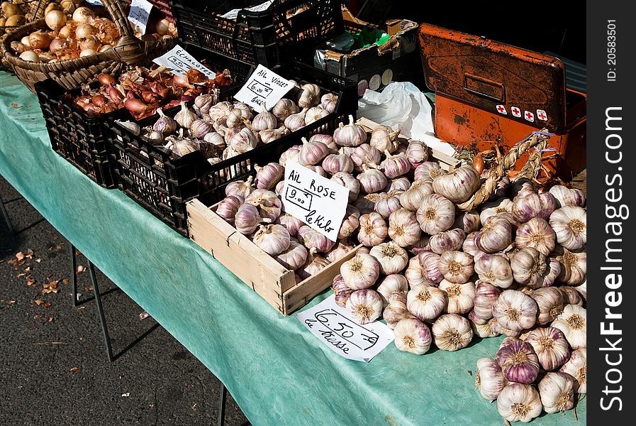 Various types of garlic for sale at a French market stall. Various types of garlic for sale at a French market stall