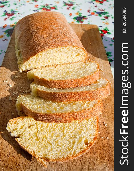 Sliced homemade sicilian bread on wooden board outdoor