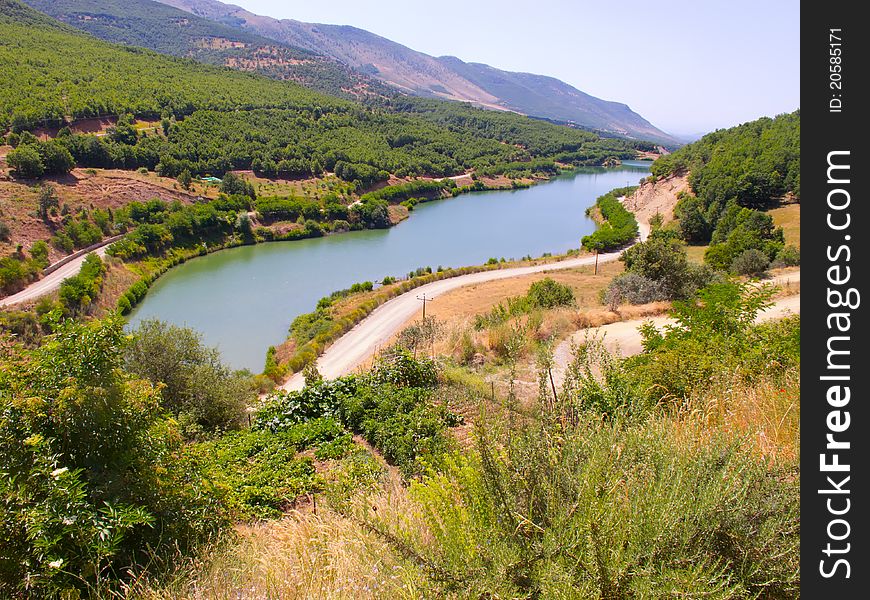 Small river between agriculture fields of vineyards