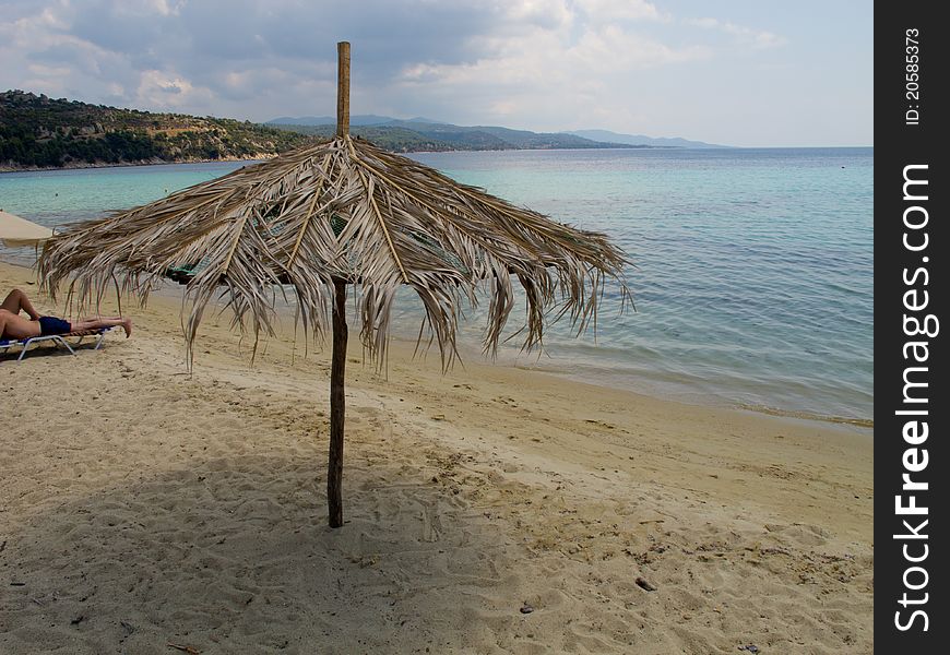 Umbrellas on a greek beach in halkidiki. Umbrellas on a greek beach in halkidiki