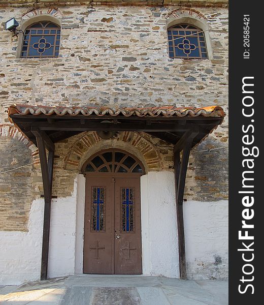 Old stone house with wooden doors windows and balkony in a greek vilage in halkidiki