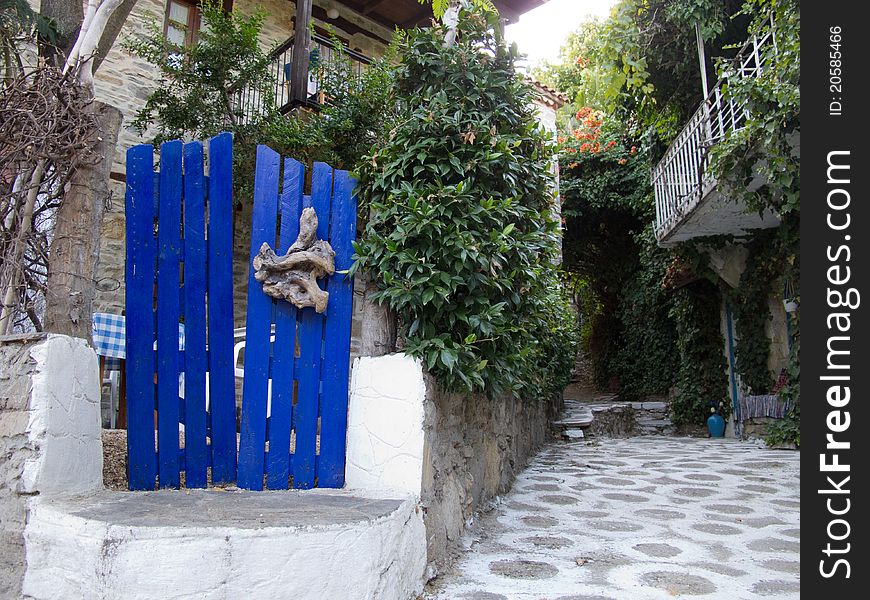 Old stone house with wooden doors windows and balkony in a greek vilage in halkidiki