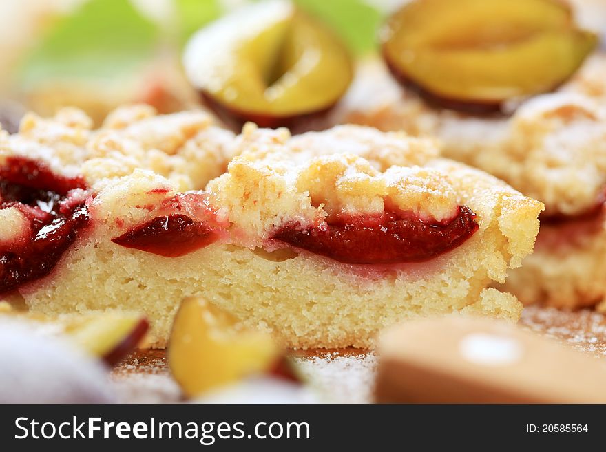 Slice of plum cake with crumb topping