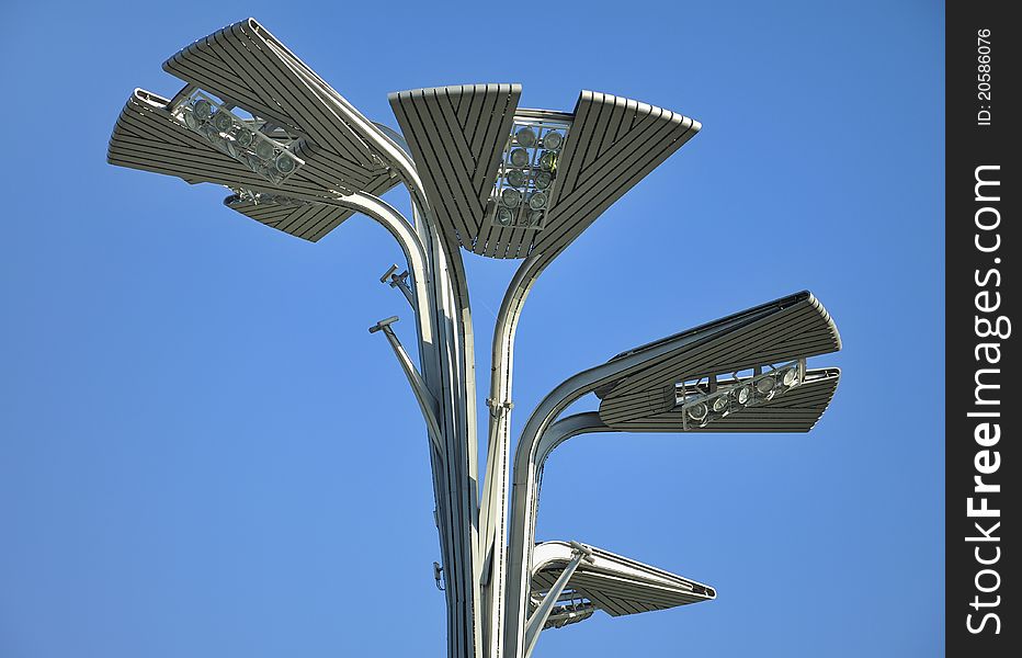 A streetlight over blue sky.