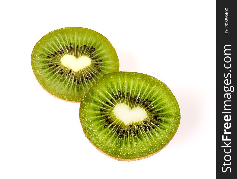 Sliced delicious kiwi with hearts inside. Sliced delicious kiwi with hearts inside