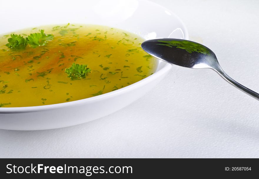 A fresh summery broth with leek onion, and carrot