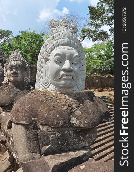 A statue to a Khmer God with an expressive face taken in Angkor Wat, Cambodia. During the war it was beheaded, so the head was later restructured. A statue to a Khmer God with an expressive face taken in Angkor Wat, Cambodia. During the war it was beheaded, so the head was later restructured.