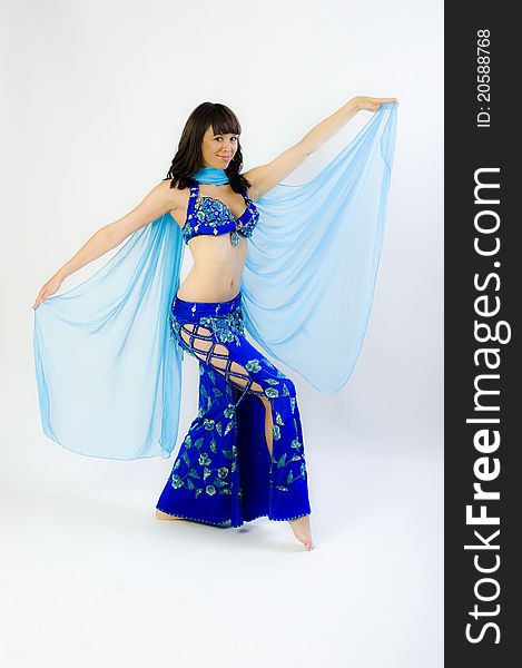Model clothes while dancing to belly dancer