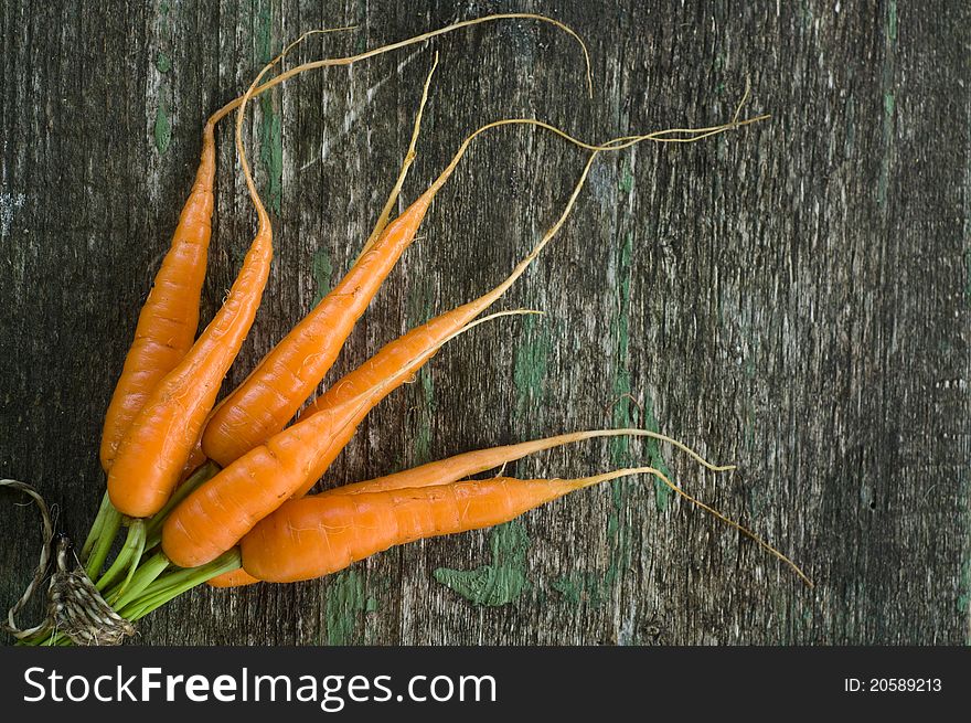 Raw carrot on wooden background. Raw carrot on wooden background