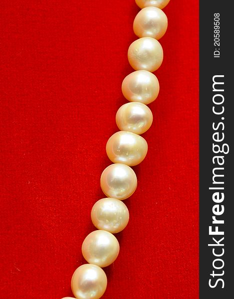 Pearls on a red cloth