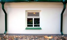 One Square Window, Two Downspouts Stock Image One Square Window, Two Downspouts Stock Image