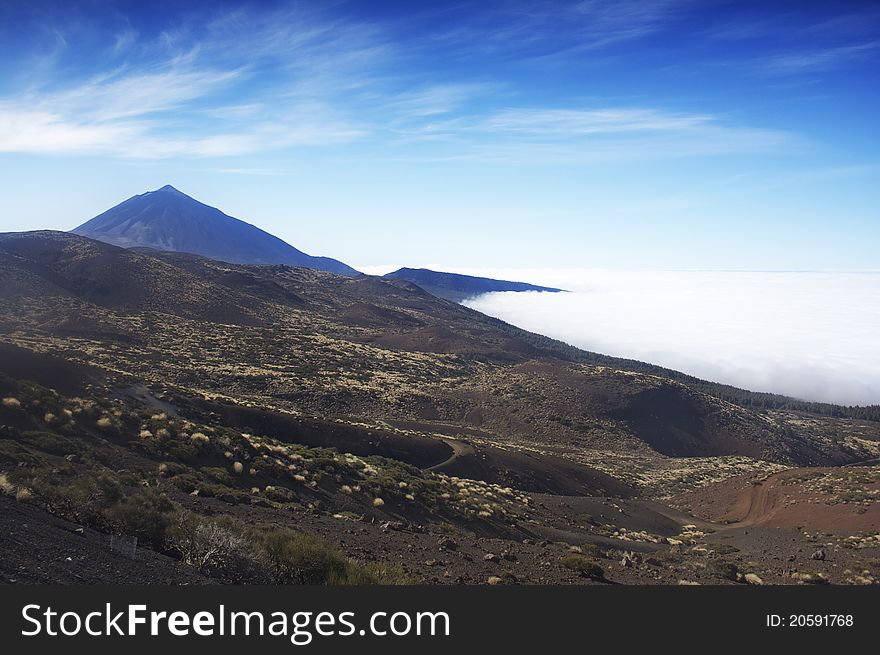 Summit of mount teide above sea of clouds. tenerife