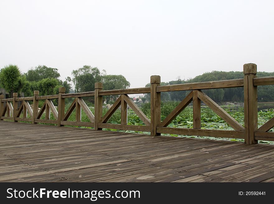 Wood bridge in a park in spring