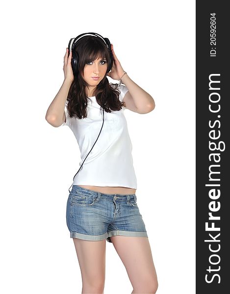 Pretty girl with brown hair and headphones on her head. Pretty girl with brown hair and headphones on her head