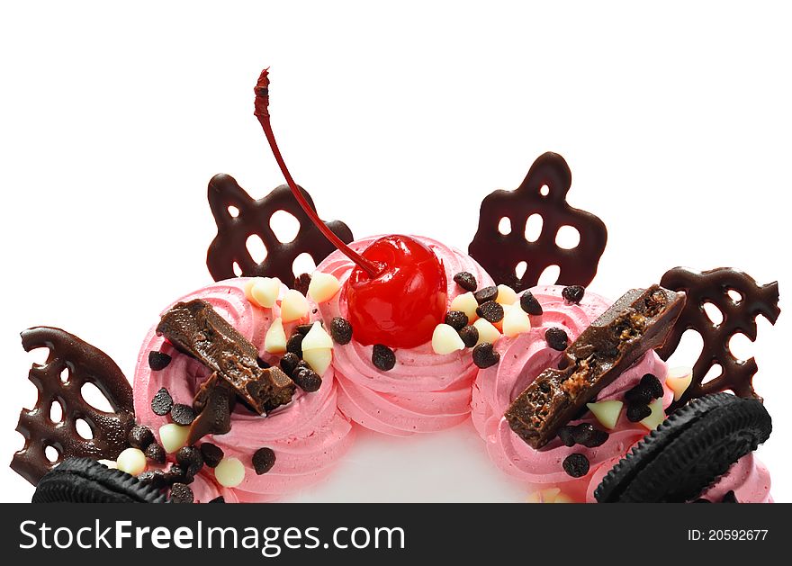 Cherry and chocolate on pink smooth cream cake