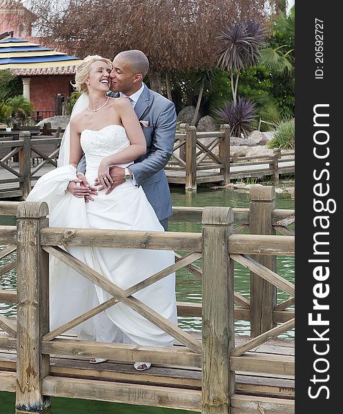 Bride and Groom in the sunshine at the reception at a golf course