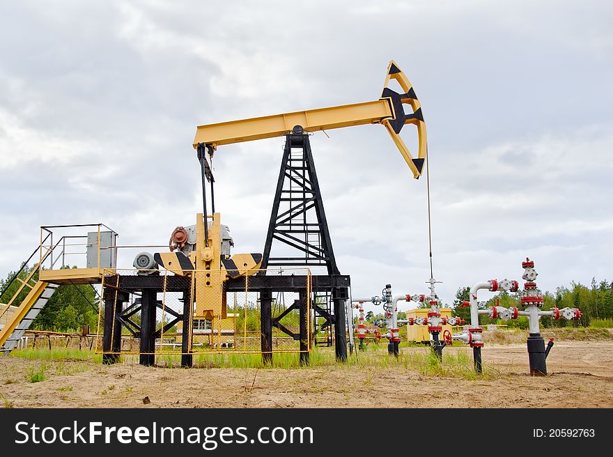 Extraction of oil. pump jack and oil well. Western Siberia. Russia.