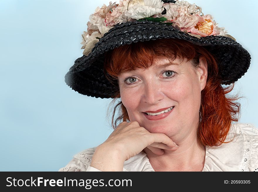 A portrait of a beautiful mature woman with red Hair smiling. A portrait of a beautiful mature woman with red Hair smiling